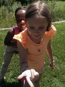 girls with bee from camp